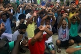 Residents of Manus Island detention centre squatting with hands above their heads hours before centre due to close