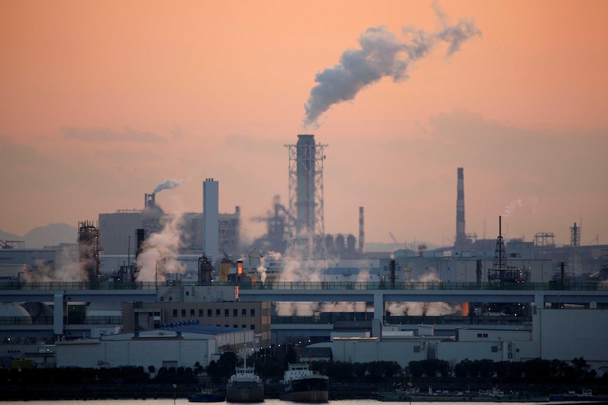 smoke billows out of factories near Tokyo