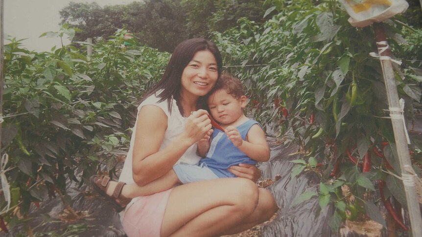A woman and her son in a garden