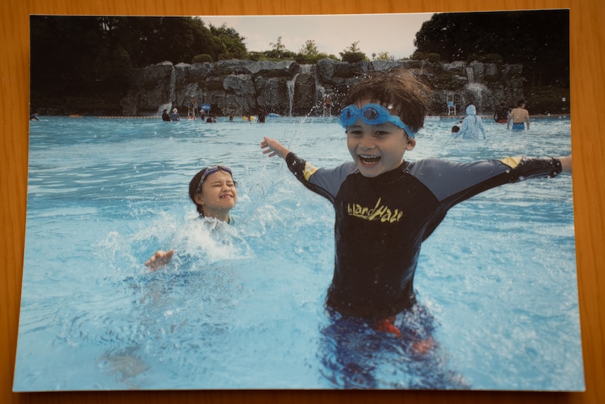 Two children in a swimming pool.