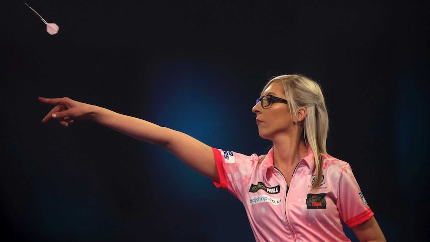 Fallon Sherrock is seen from side on throwing a dart at the World Championship