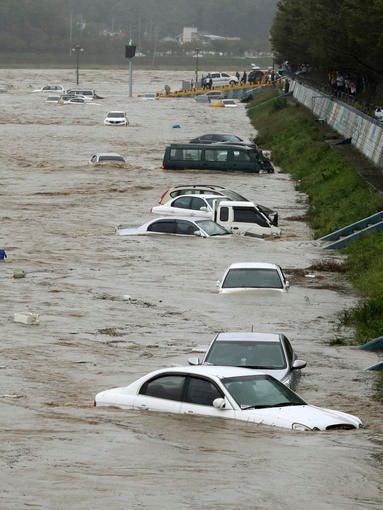Vehicles submerged in floodwaters caused by Typhoon Chaba in Gyeongju, South Korea.