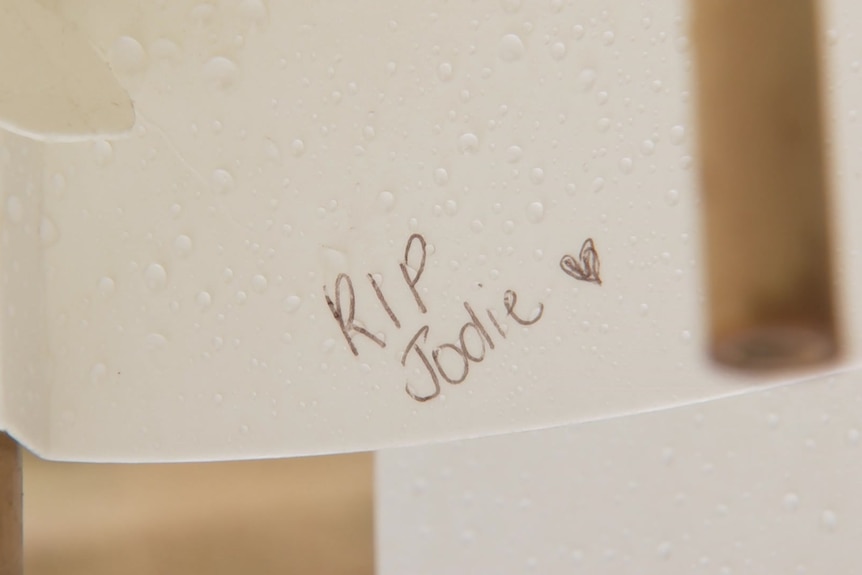 A close up of an art installation with 'RIP Jodie' written on it.
