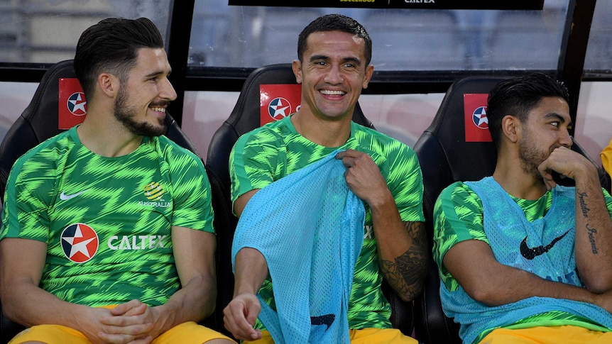 Tim Cahill smiles on the Socceroos bench