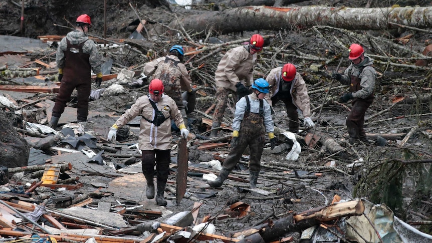 Rescuers search debris from massive mudslide