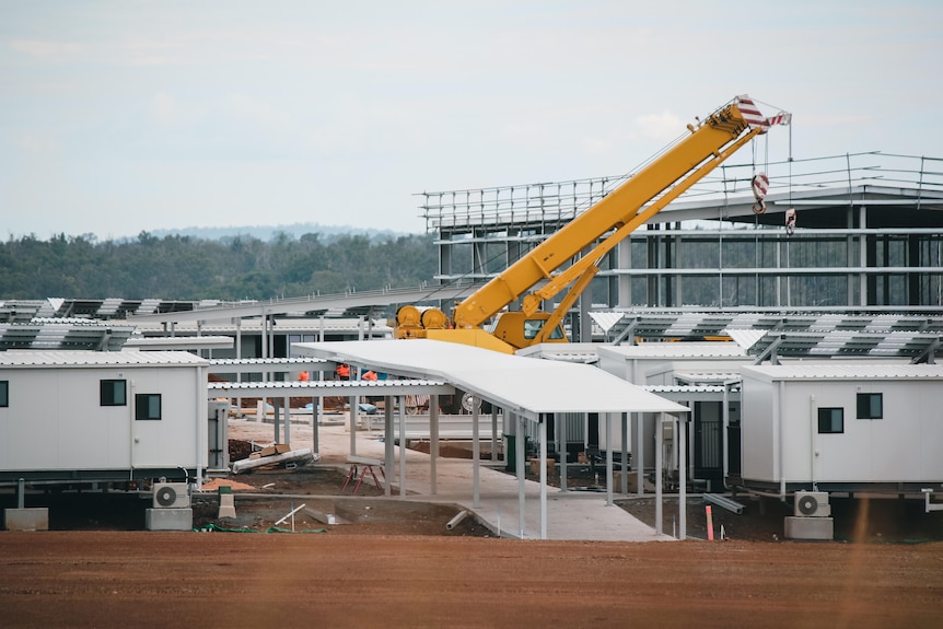 A crane lifts construcuton material