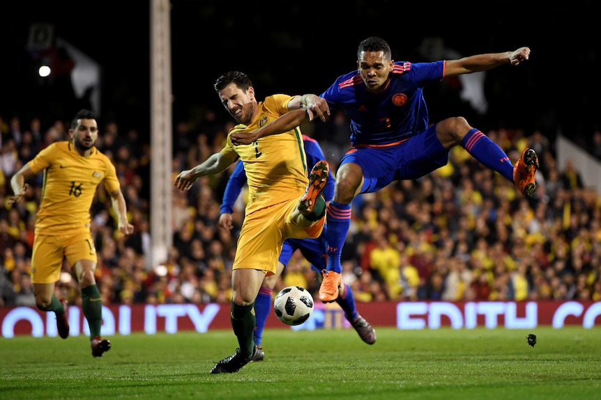 Australia's Milos Degenek in action with Colombia's Carlos Bacca in a friendly at Craven Cottage.