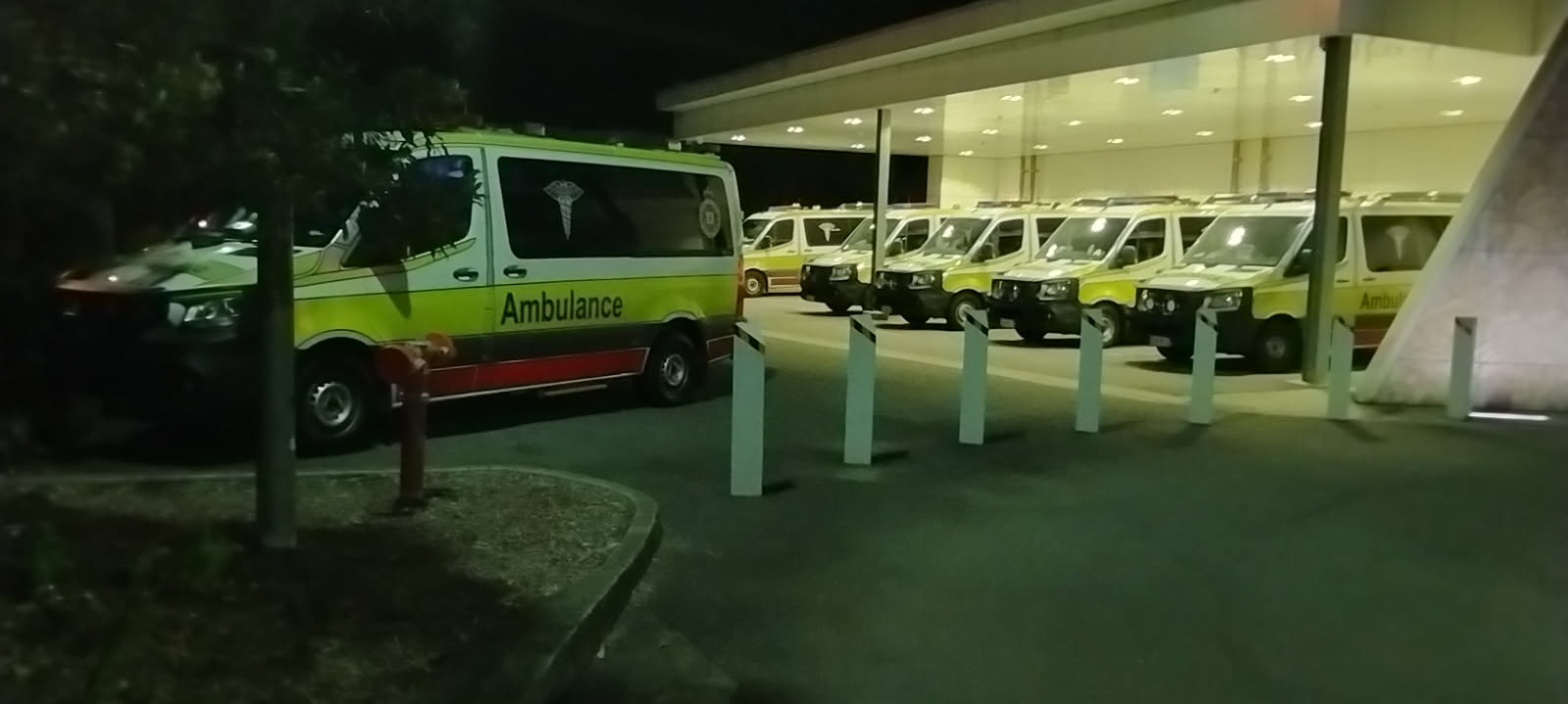 a parking lot full of ambulances
