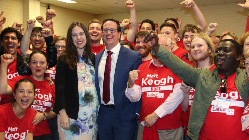 Matt Keogh and his wife Annabel surrounded by Labor supporters in Burt.