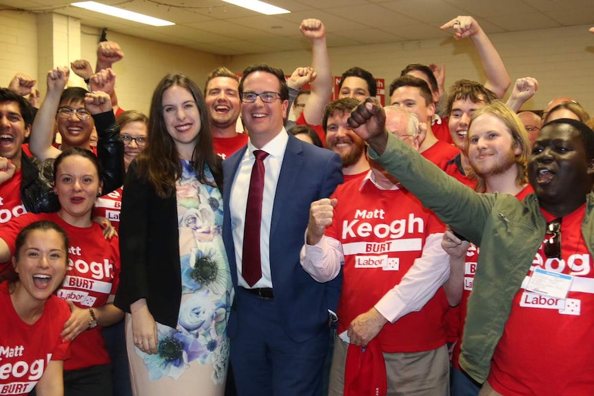 Matt Keogh and his wife Annabel surrounded by Labor supporters in Burt.