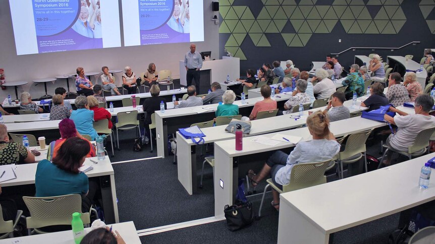 A group of mostly older Australians inside a lecture theatre at the Ageing in North Queensland 2016 symposium