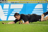 Richie McCaw dives over