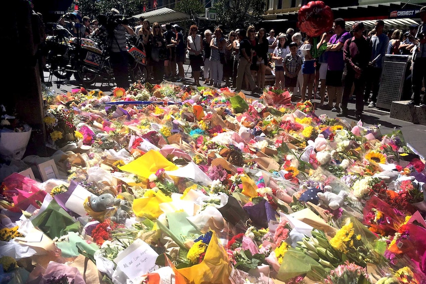 Two days after a car drove through Bourke Street, killing five, flowers are left for the victims.