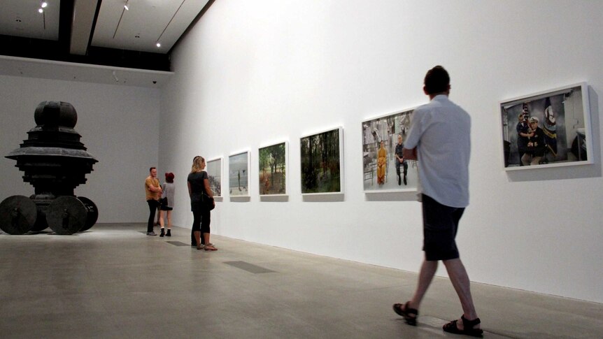 A man walks into one of the galleries at the Asia Pacific Triennial.
