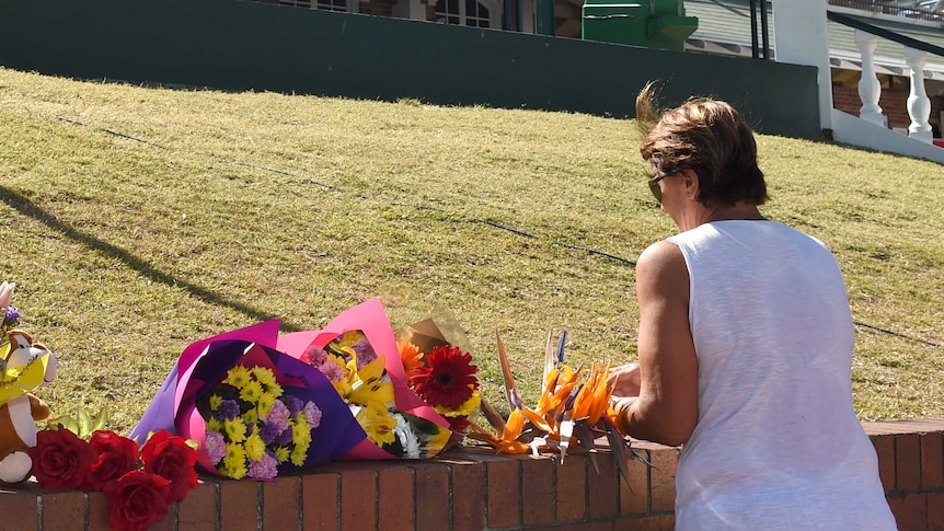 Flowers are laid outside the Dreamworld Theme Park on the Gold Coast.