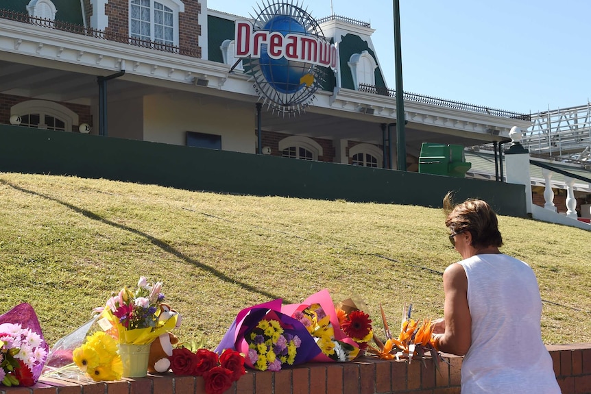 Flowers are laid outside the Dreamworld Theme Park on the Gold Coast.