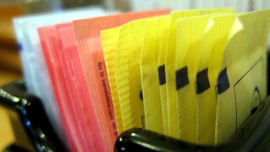 Artificial sweeteners in a container. 