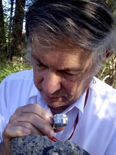 Dr Andrew Glikson studies samples from the two ancient asteroid craters found in central Australia.