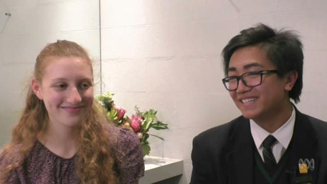 Two teenage students sit for interview