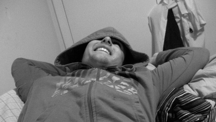 Ben Ison, laying down and laughing, happy during the good times.