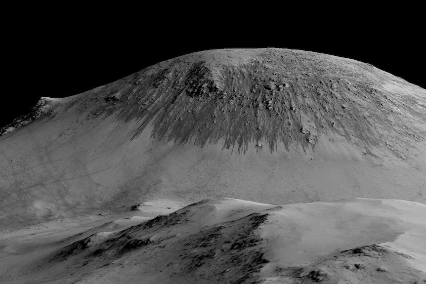 Dark streaks flowing downhill on Horowitz crater on Mars