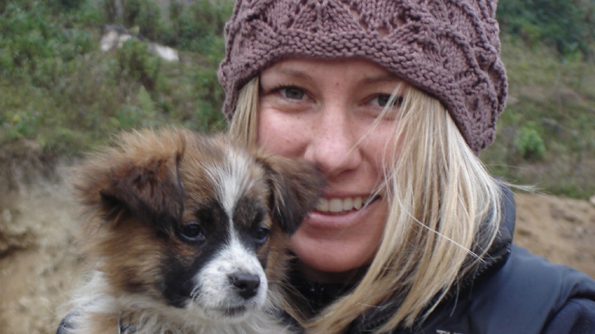 Justine Damond Ruszczyk holds a puppy.