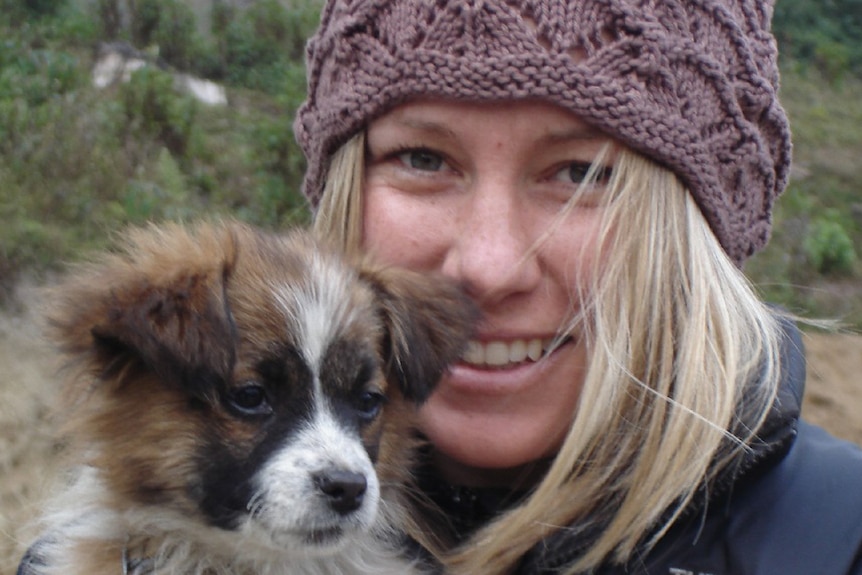 Justine Damond Ruszczyk holds a puppy.