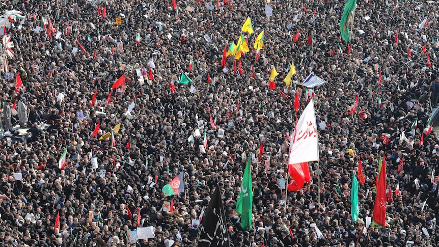 Mourners attend a funeral ceremony for Iranian Gen. Qassem Soleimani and his comrades.