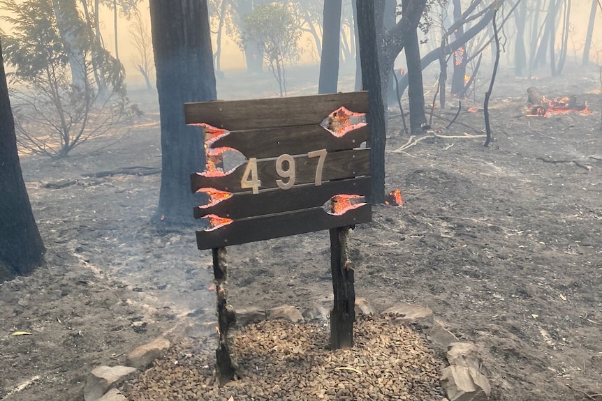 A flaming house number sign.