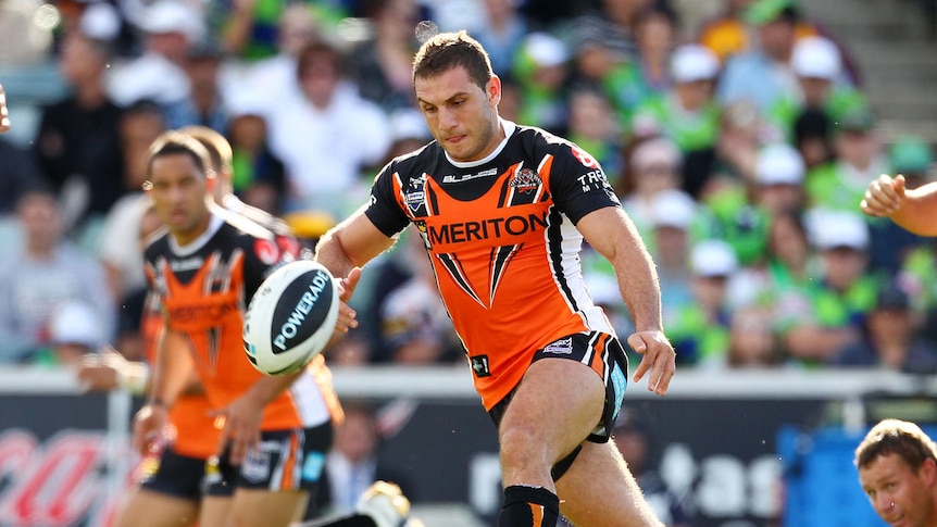 Chip and chase: Robbie Farah sets up a try for Benji Marshall in the first half.