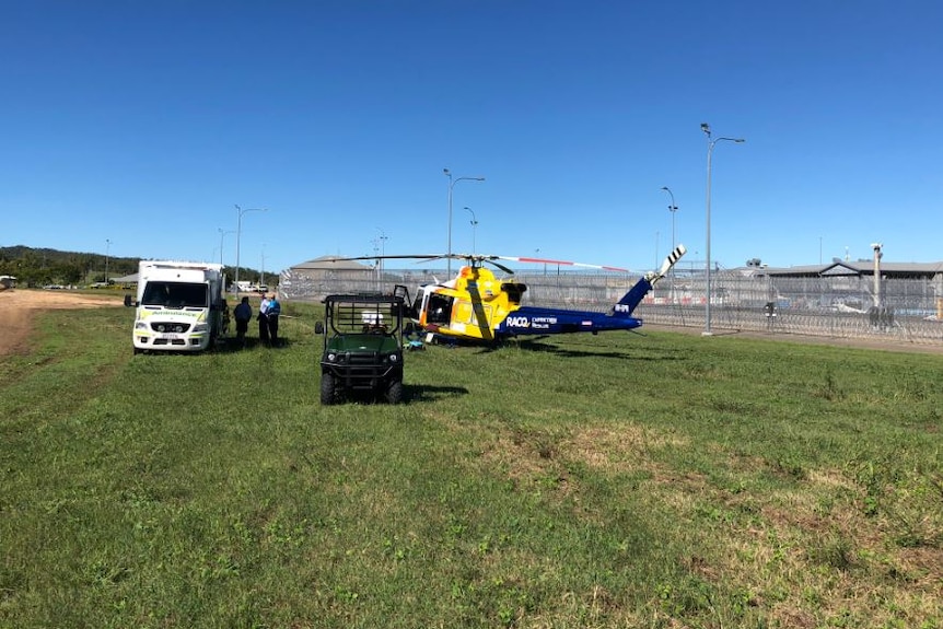An ambulance and rescue chopper outside a prison