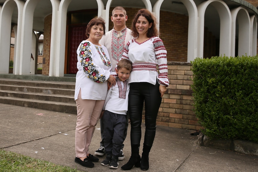 a family of two women, and two boys one younger and one older