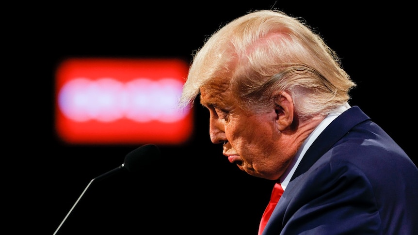 President Donald Trump reacts during the second and final presidential debate