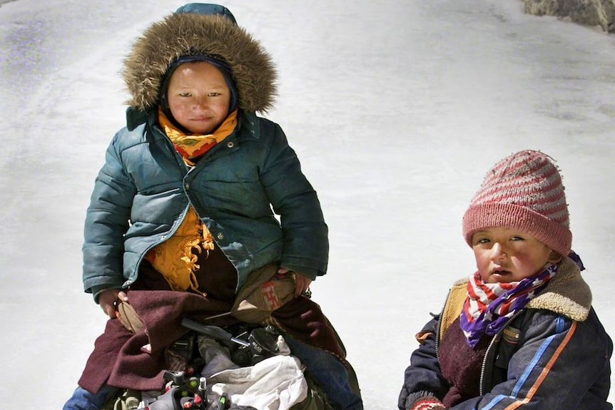 Children sit on sleighs in one of the remotest parts of India.