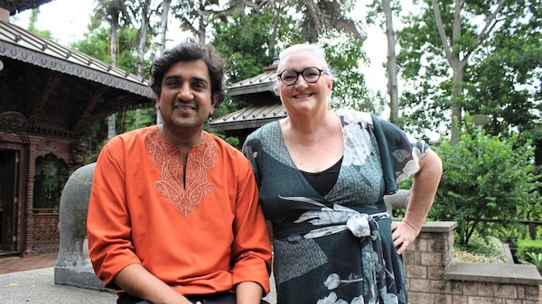 Ashwin Segkar and Kelly Higgins-Devine in front of a Nepalese Peace Pagoda