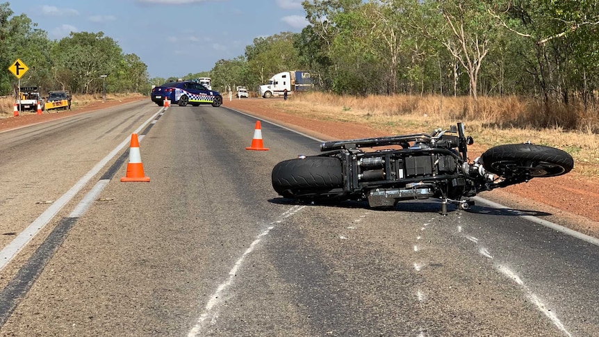 A motorbike lies on the road