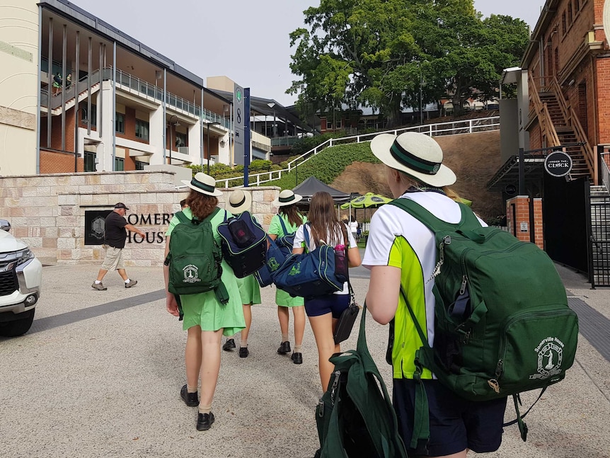 Students entering Somerville House girls' boarding school in Brisbane the morning after a stabbing on the premises.