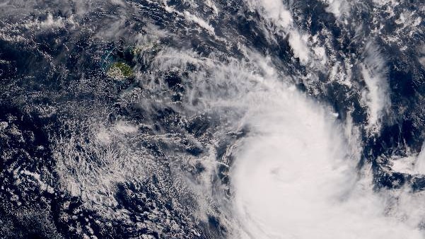 You see a satellite image over the South Pacific showing Cyclone Harold pass in the bottom-right corner of the image.