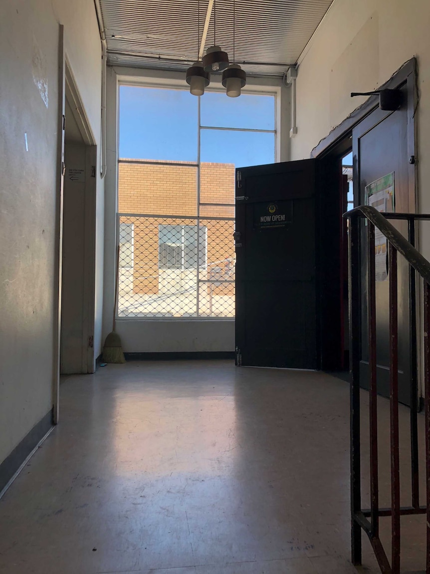 The top of a landing at a warehouse in Brunswick. A blue sky is visible out the window.