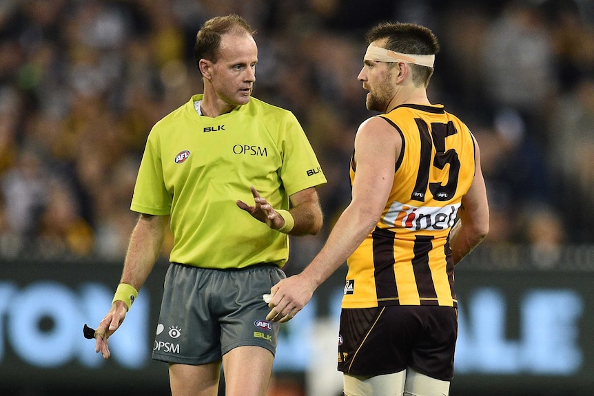 Luke Hodge speaks to an umpire