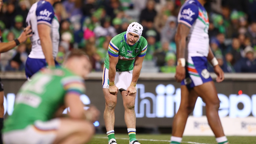 A man looks dejected during a loss in a rugby league game