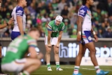 A man looks dejected during a loss in a rugby league game