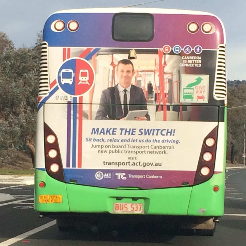 Kristian Mynott's picture on the back of a bus