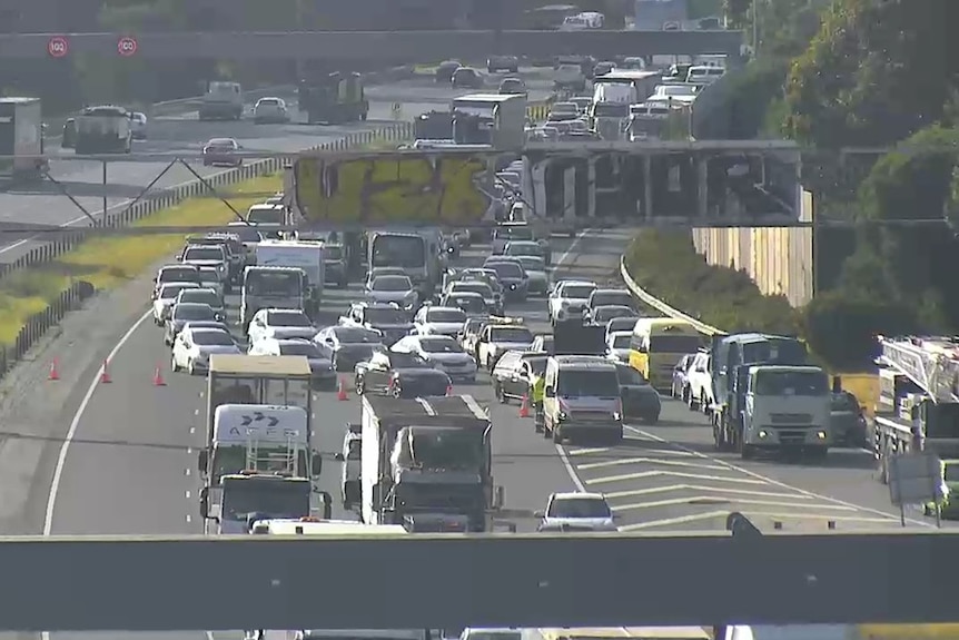 Several lanes of cars and trucks backed up on the Monash Freeway.