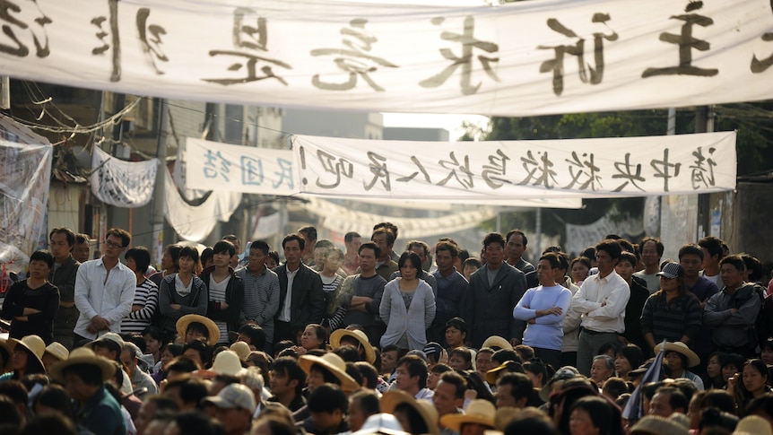 Residents of Wukan, a village in Guangdong, rally to demand the government take action over illegal land grabs