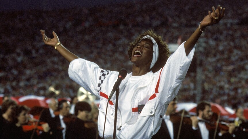 Whitney Houston sings the National Anthem before a game with the New York Giants taking on the Buffalo Bills