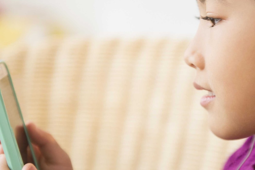 girl using phone with earphones