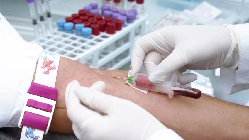 A person having a sample of blood taken for a clinical trial.