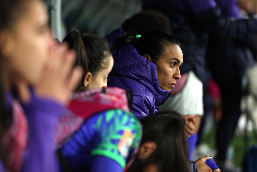 Brazil player Marta sits on the bench during a match at the 2023 FIFA Women's World Cup.