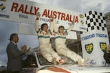 Kenjiro Shinozuka and Fred Gocentas celebrate at the 1988 Rally Australia event in Perth.